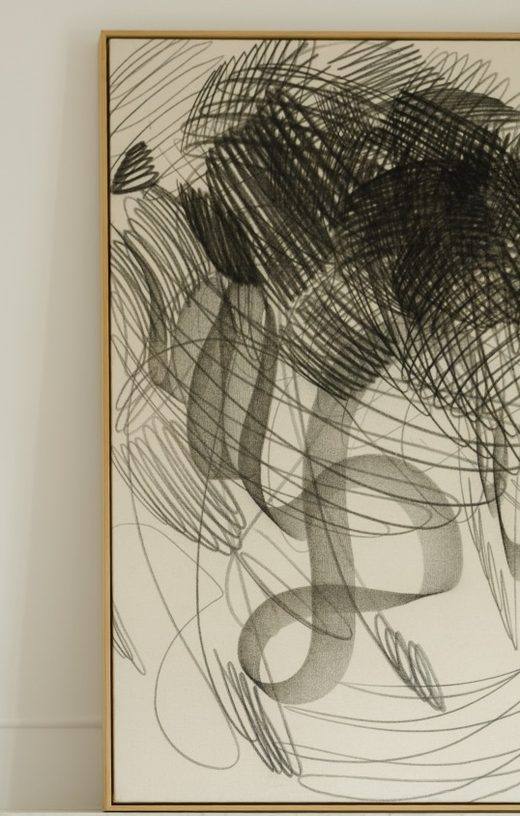 Large charcoal drawing above a marble fireplace