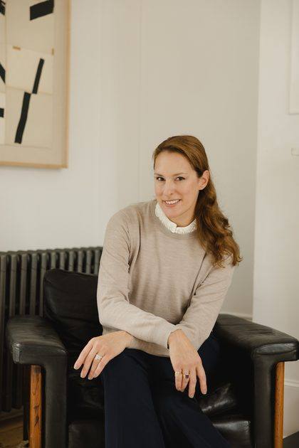Anastasia Roumelioti seated, looking to camera
